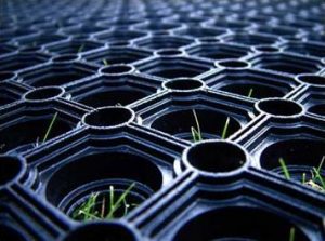 How do rubber grass mats work