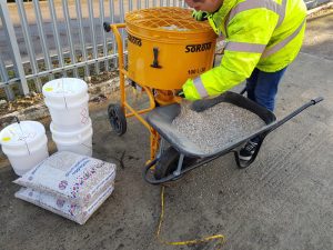 SoRoTo forced action mixer in use with wheelbarrow