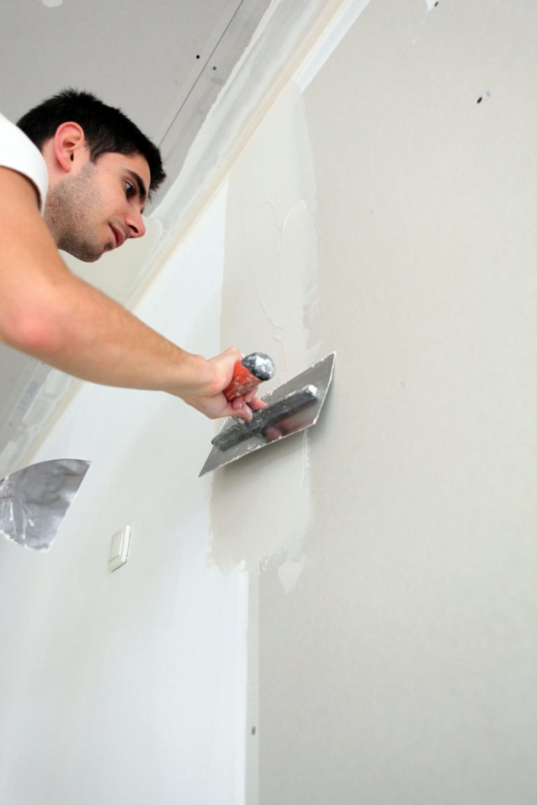 Man with plastering trowel