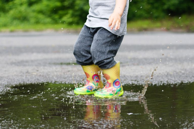 Child in flood on a non-porous driveway