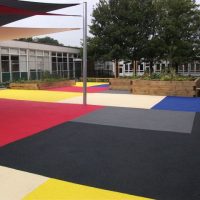 Multi coloured wet pour surfacing used by a school