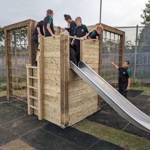 Children Playing Safely On Climbing Frame