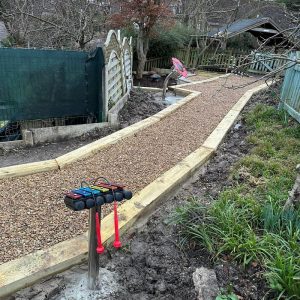 X-Grid Gravel Path Contained By Wooden Sleepers