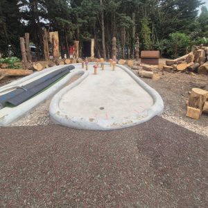 Rubber Mulch Pathway In Front Of A Hole