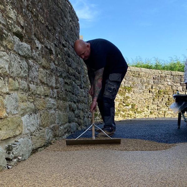 Spreading Springtime Resin Bound Gravel Using A Spazzle